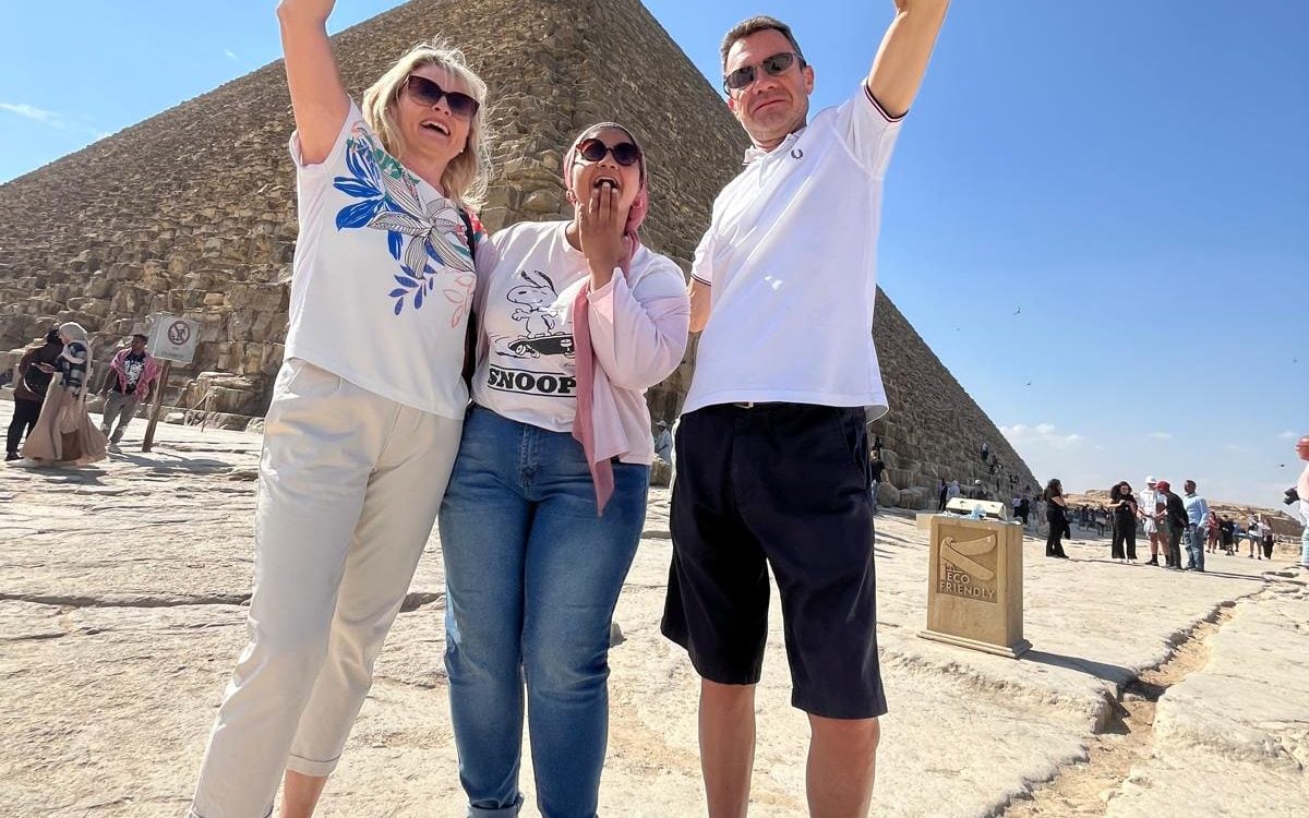 Happy Shots Holding The Pyramid