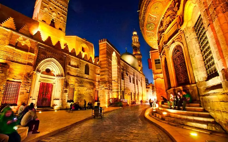 A-wonderful-view-of-Al-Moez-Street-at-night-showing-the-beauty-of-Islamic-architecture-and-some-visitors